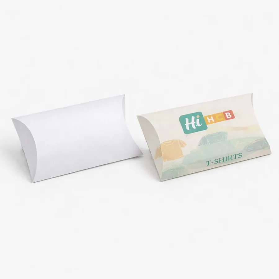 Two horizontal pillow boxes for t-shirts- one plain white and one with colourful brand illustrations- class=